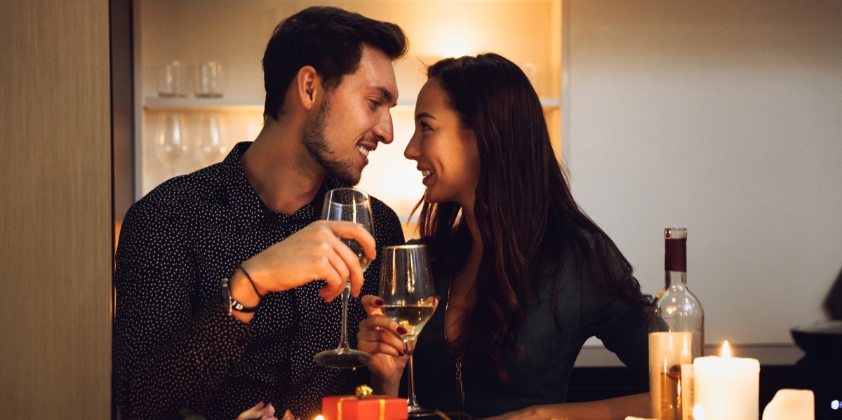 man and woman eating dinner at home