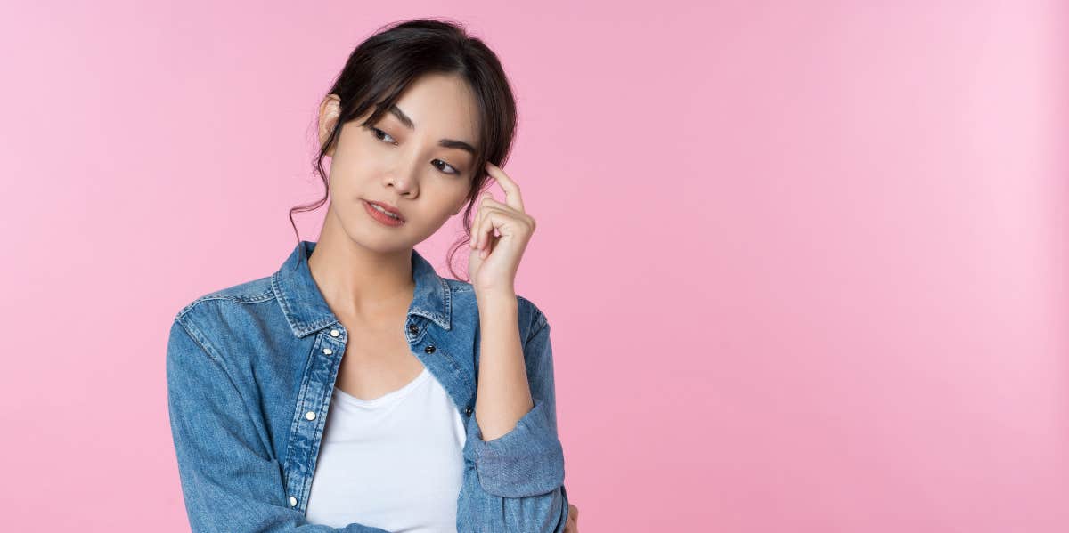 Signs You're Deluding Yourself About Him (And He's Not Really Into You) woman thinking