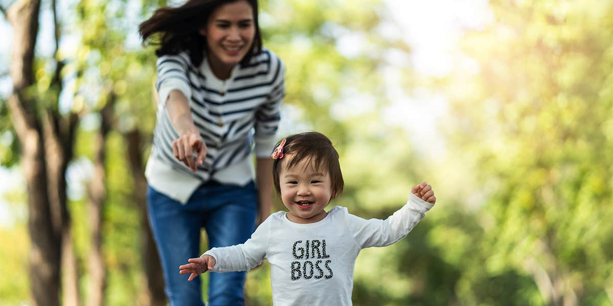 mom chasing toddler