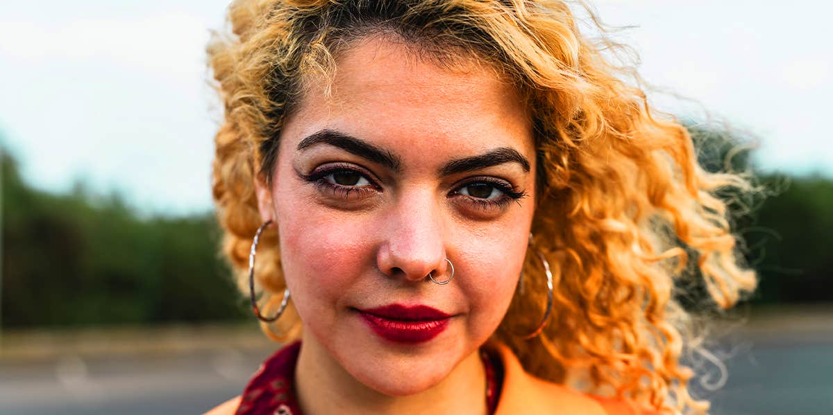 Things Guys Do That Really Piss Off Independent Women woman with curly hair