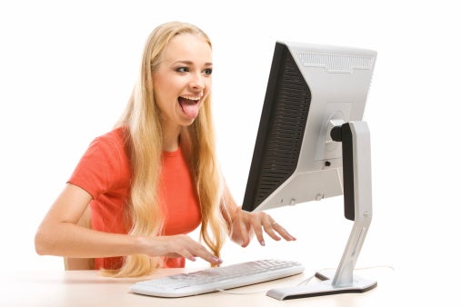 woman using computer Relationship Fail: Mushy, Gushy Couple Nausea On Facebook