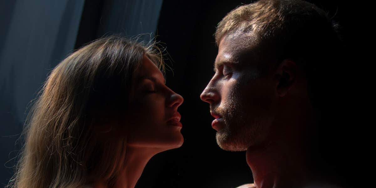 intimate couple in dark room