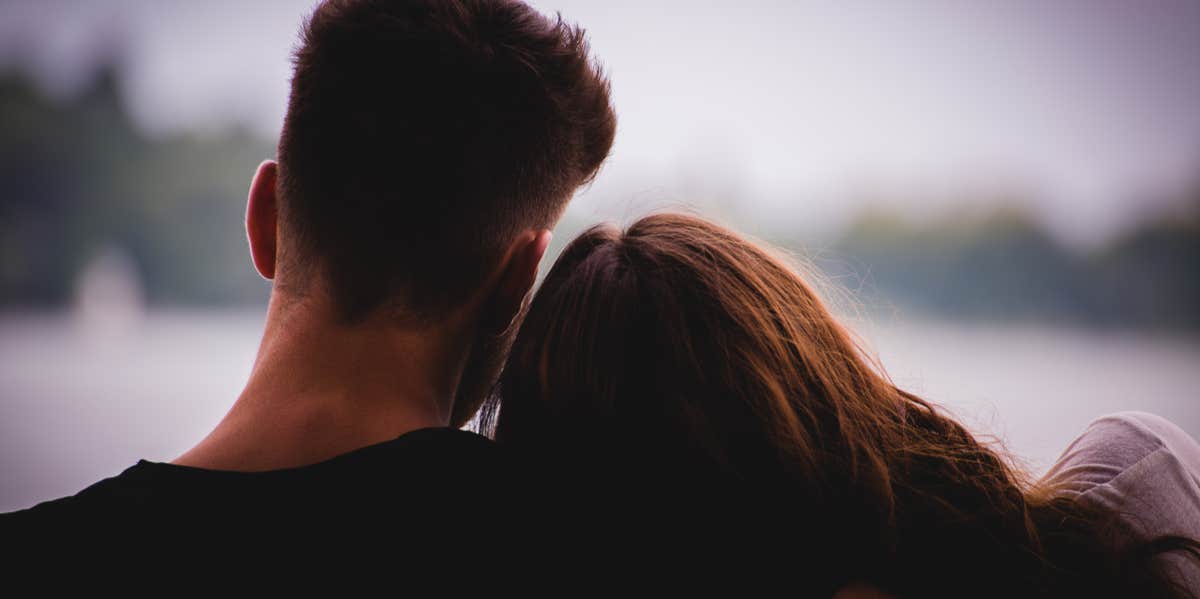 12 Brutal Truths About Loving Someone Who's Been Single Forever woman leaning on man