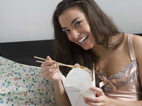 woman eating chinese food