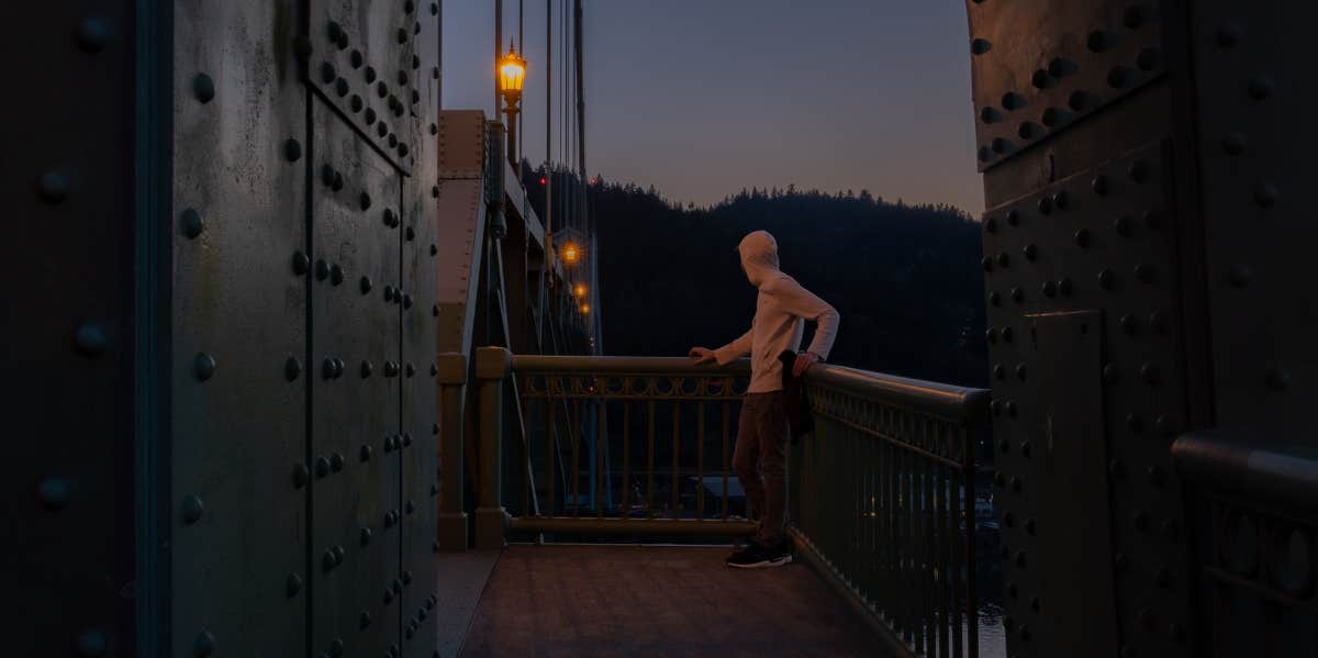 Signs He's Full Of It (And You Should Move On) man on bridge