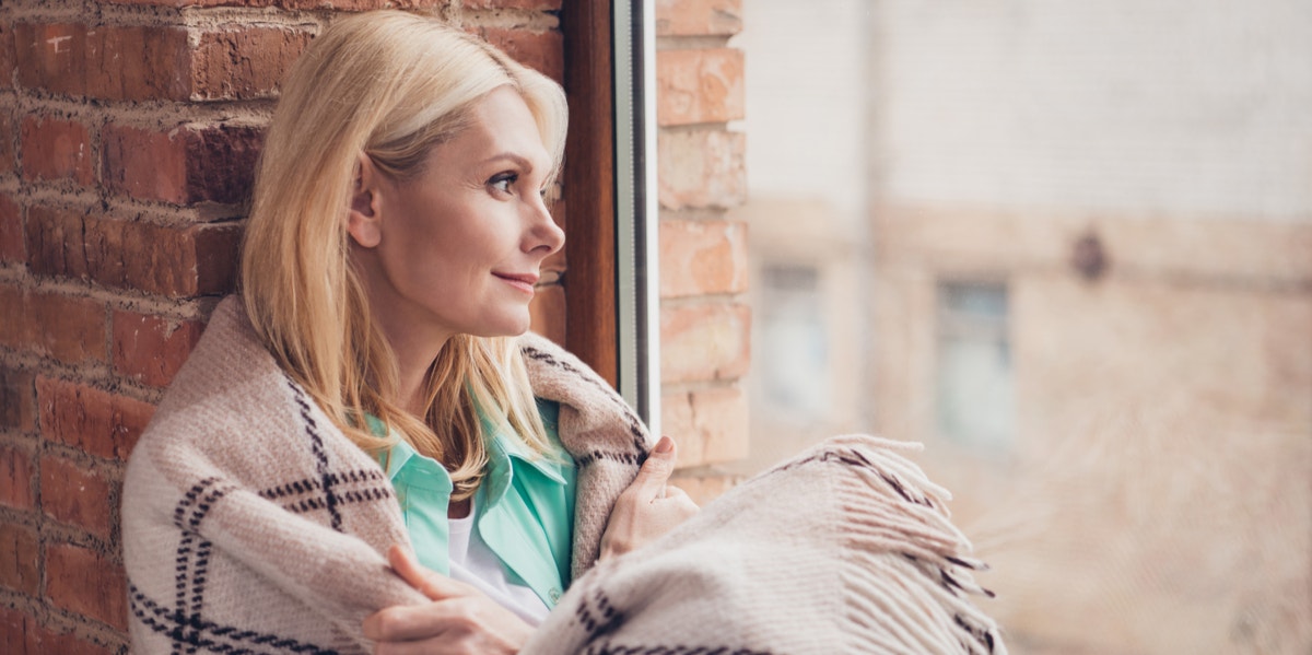 happy woman looking out window