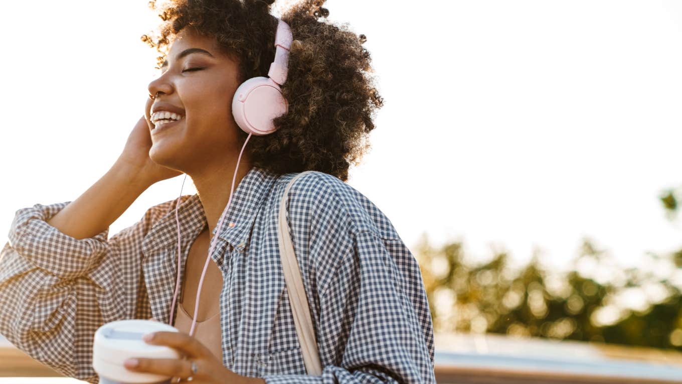 Woman smiling listening to music 