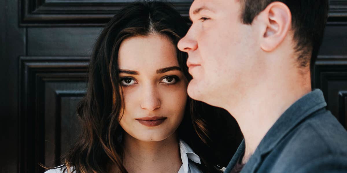 man and woman standing in front of door