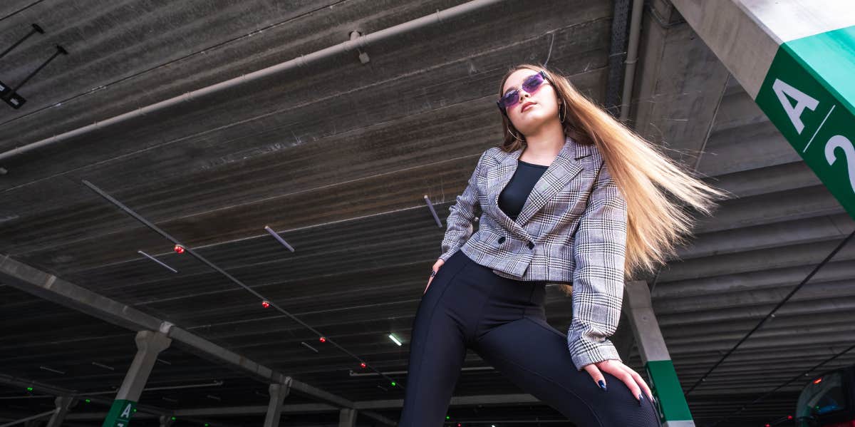 woman standing in parking garage