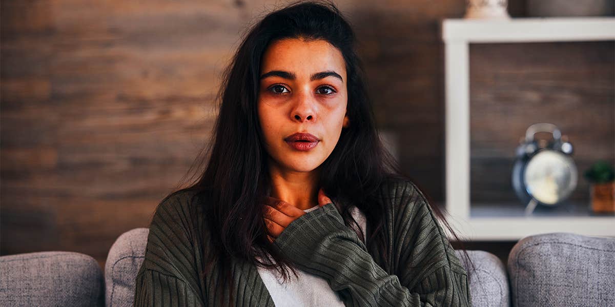 anxious woman doing breathing technique 