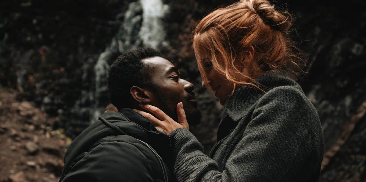 man and woman kissing