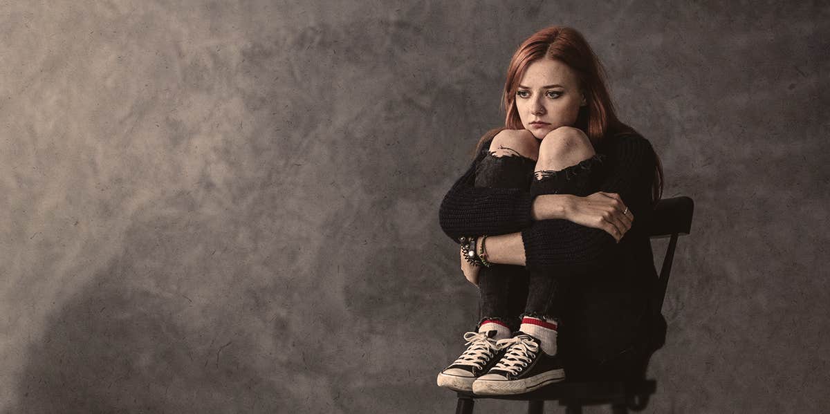 2 Surprising Ways To Instantly Overcome Crippling Shame woman sitting bending the knee