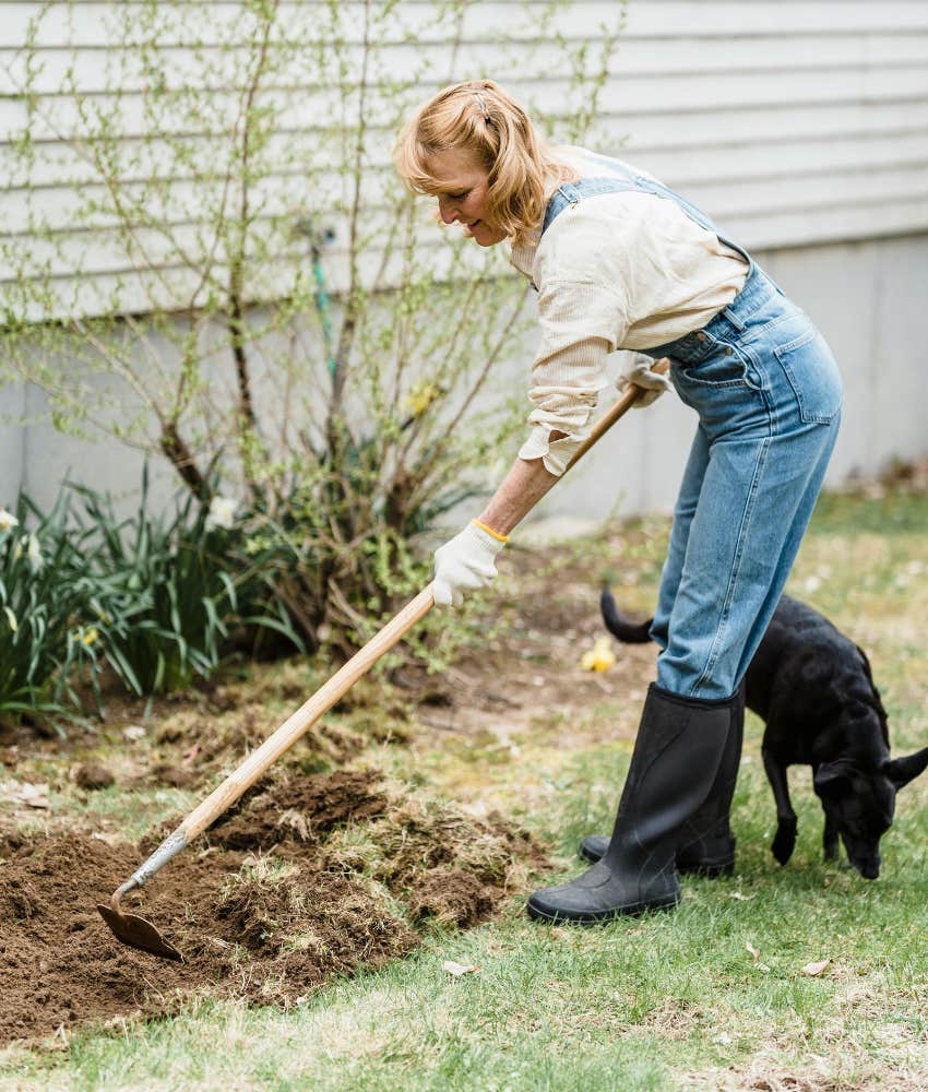 woman gardening with dog 