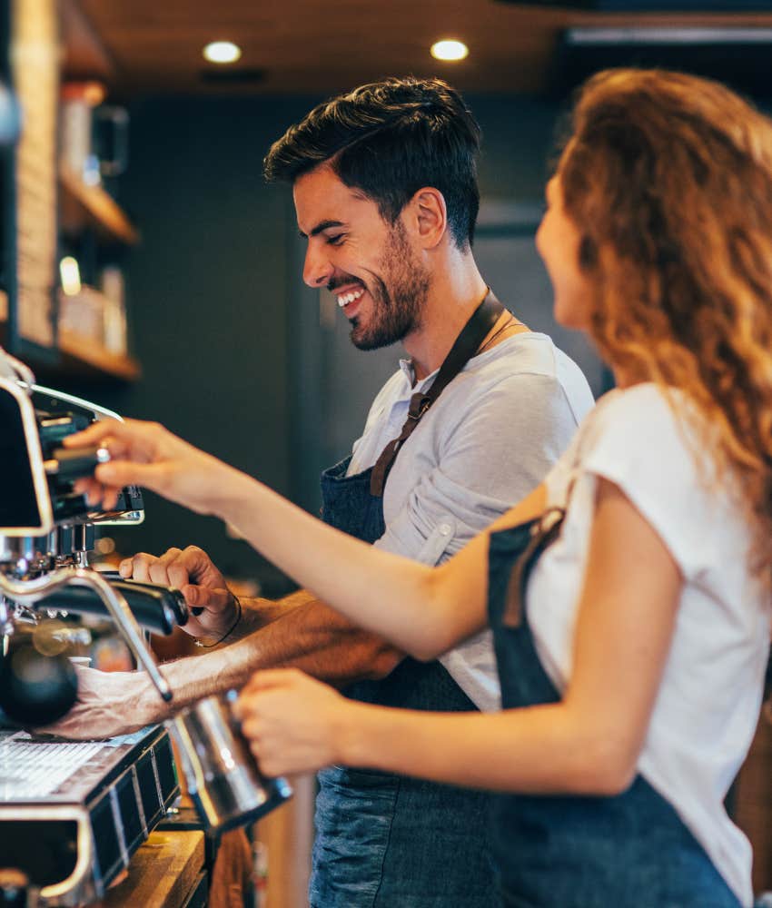  two baristas making coffee