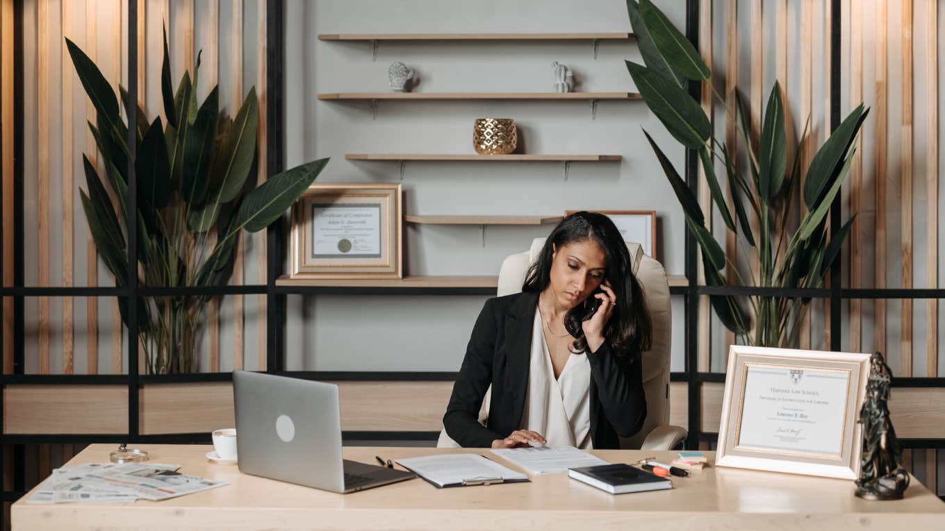 Black woman in office on the phone