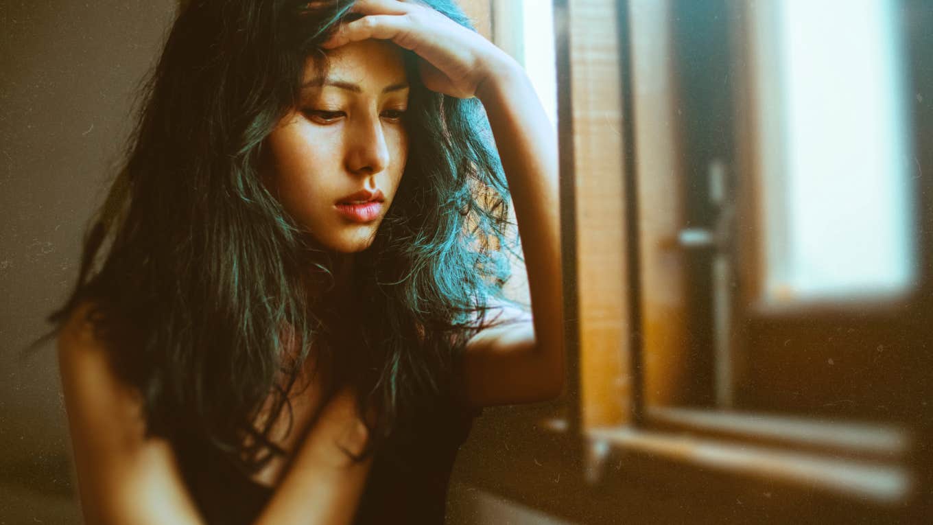 Breakup Advice And The One Bizarre Thing That Causes All Breakups Bizarre thing that causes all break ups, woman with hand on forehead looking down