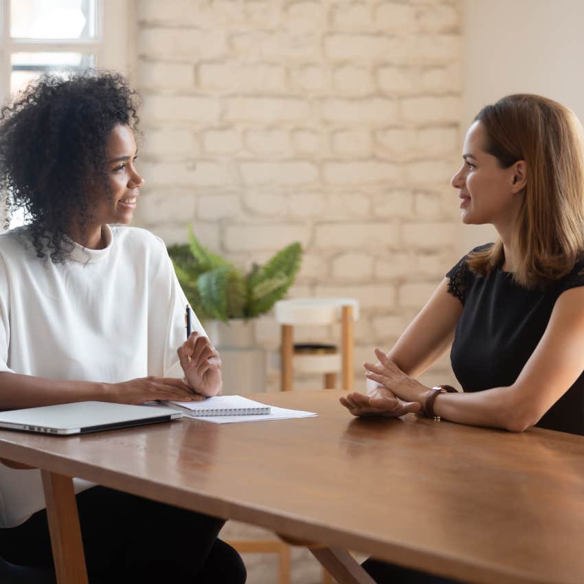 young businesswoman talking with female job candidate at office meeting