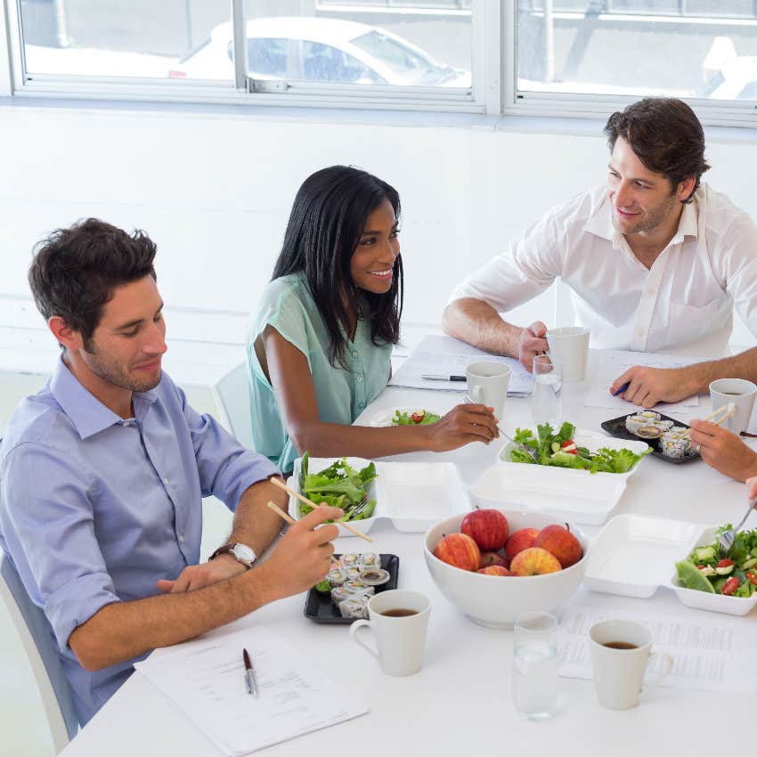 Co-workers eating lunch together