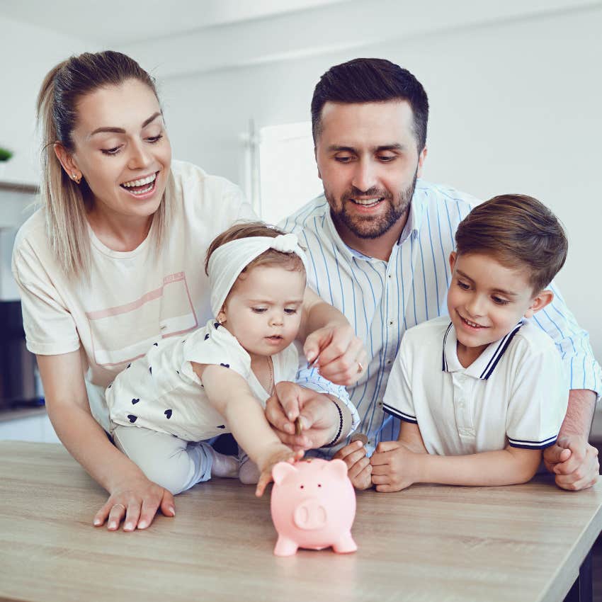 family putting change in a piggy bank