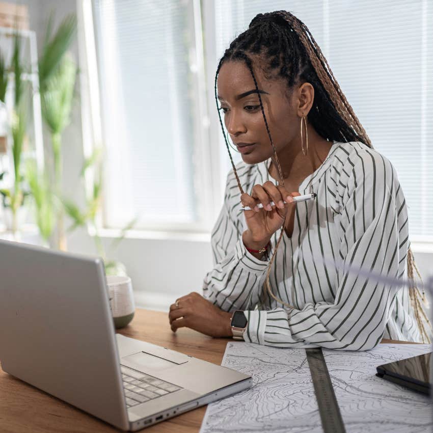 Gen Z worker working on her laptop. 