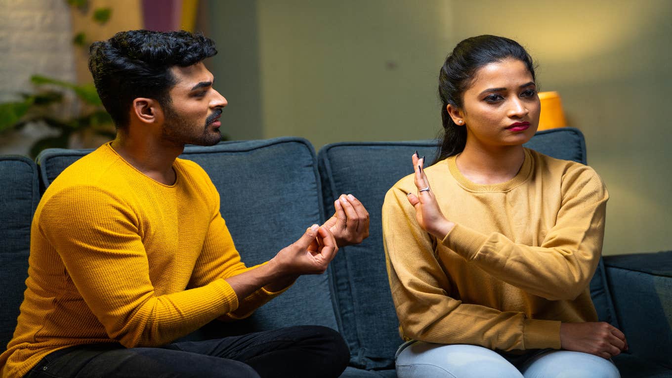 couple arguing on couch