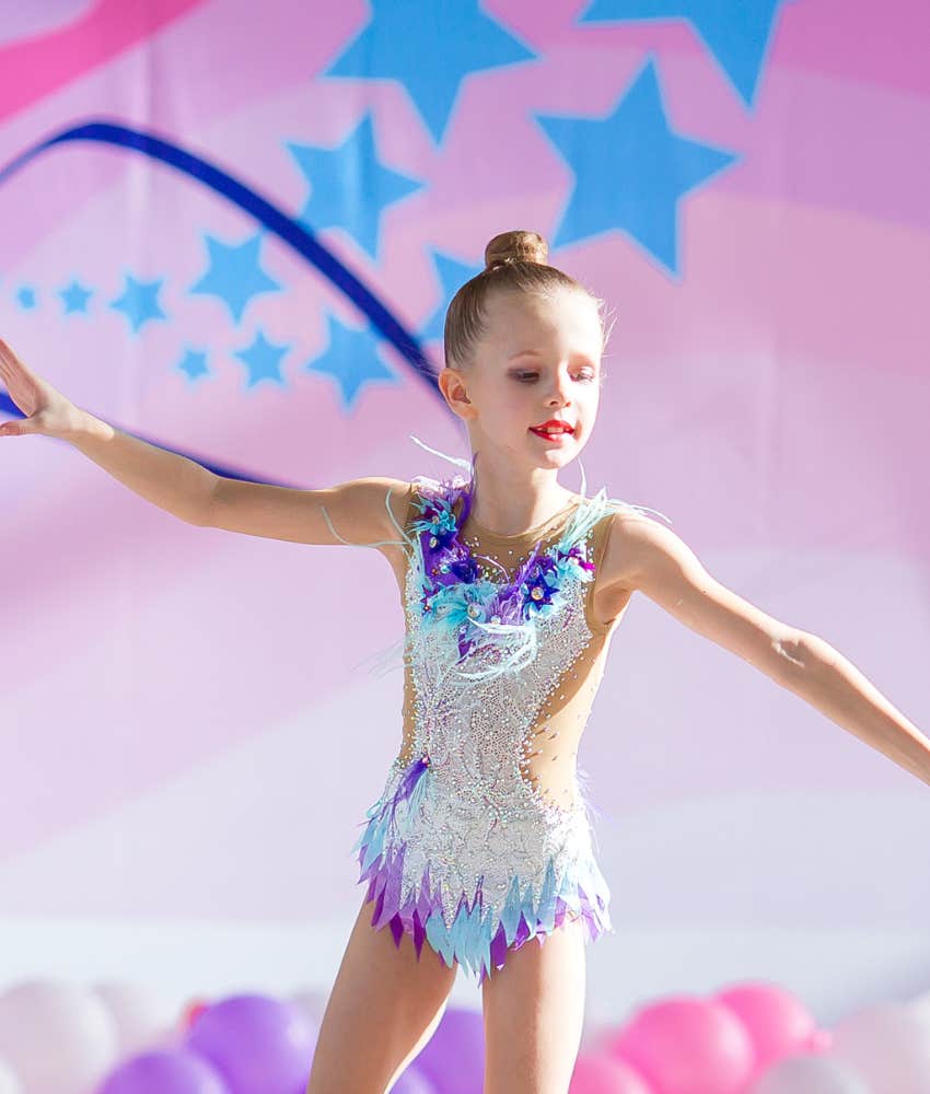 little girl doing gymnastics