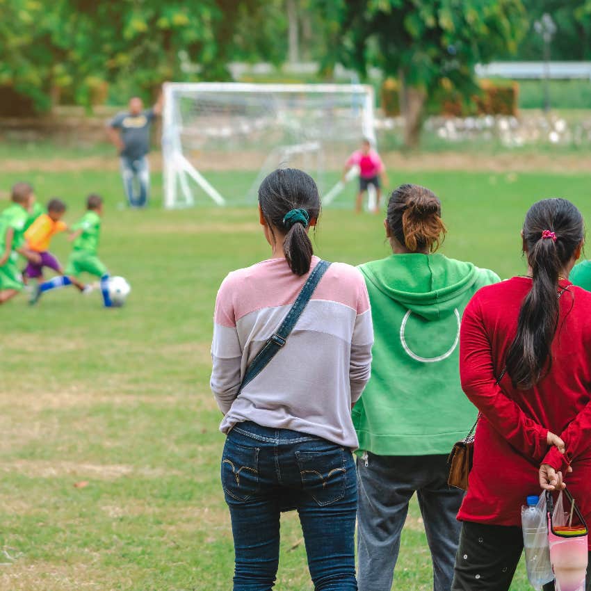 Moms watching their kids play soccer