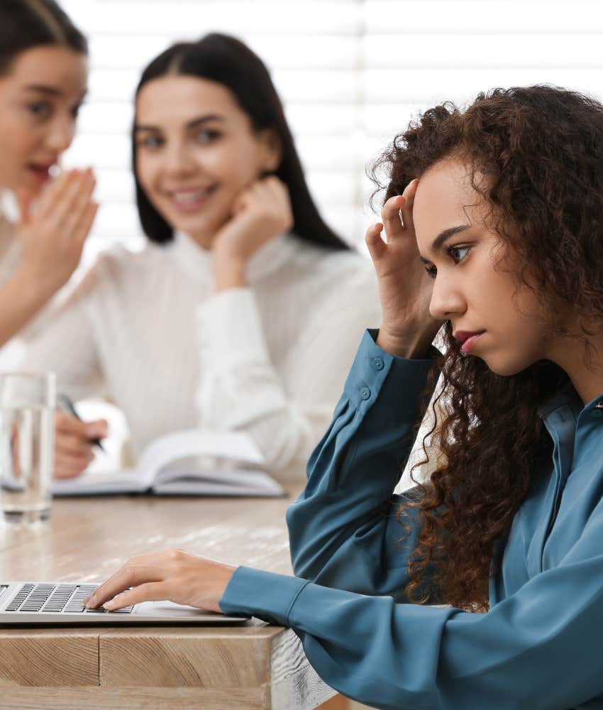 women gossiping about colleague