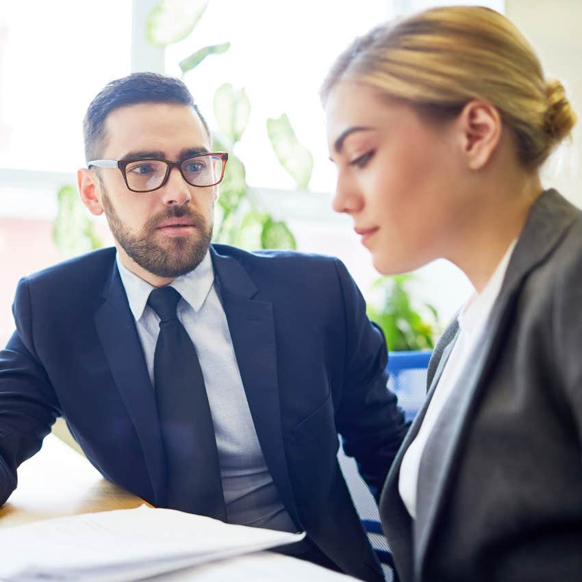 man talking to woman in office