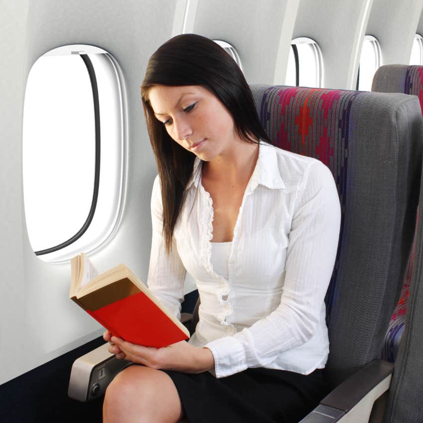 woman reading on airplane