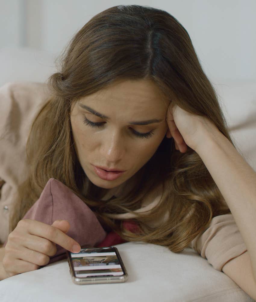 woman scrolling internet on her phone