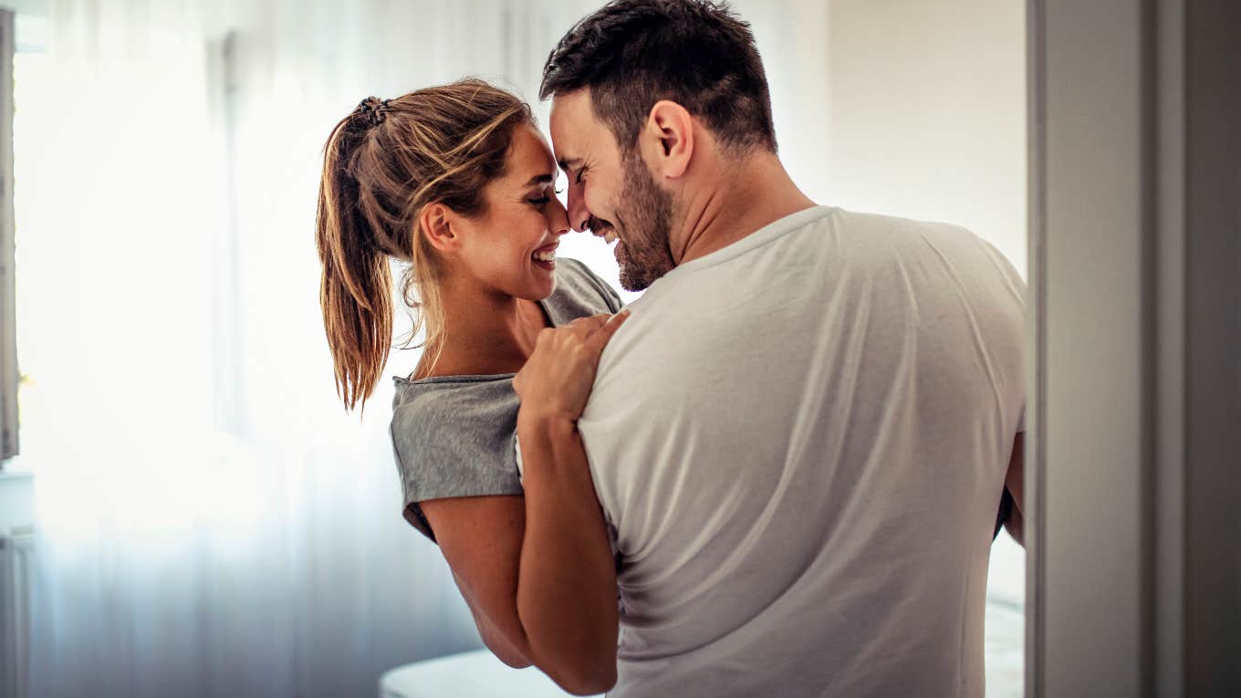 20 Words Of Affirmation Examples For Men — And How To Speak This Love Language woman making her man smile