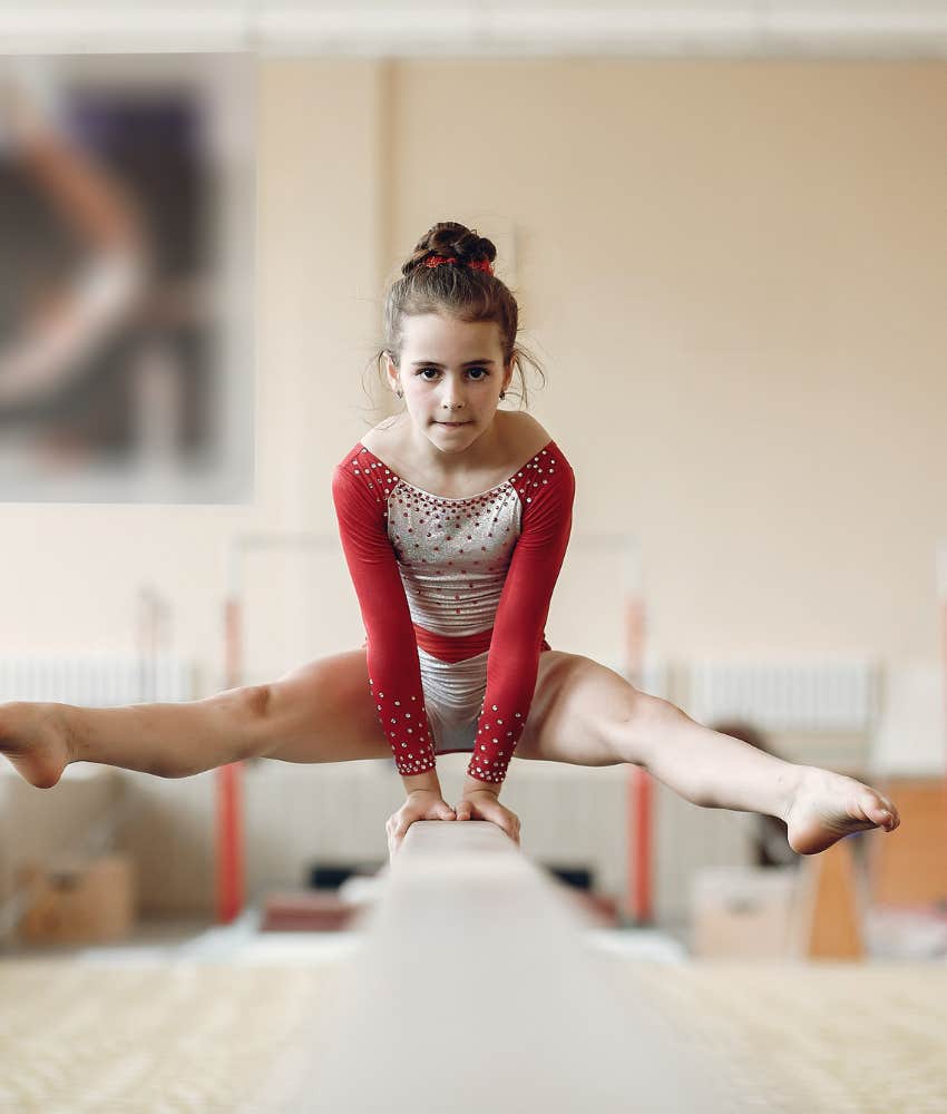 young girl on balance beam