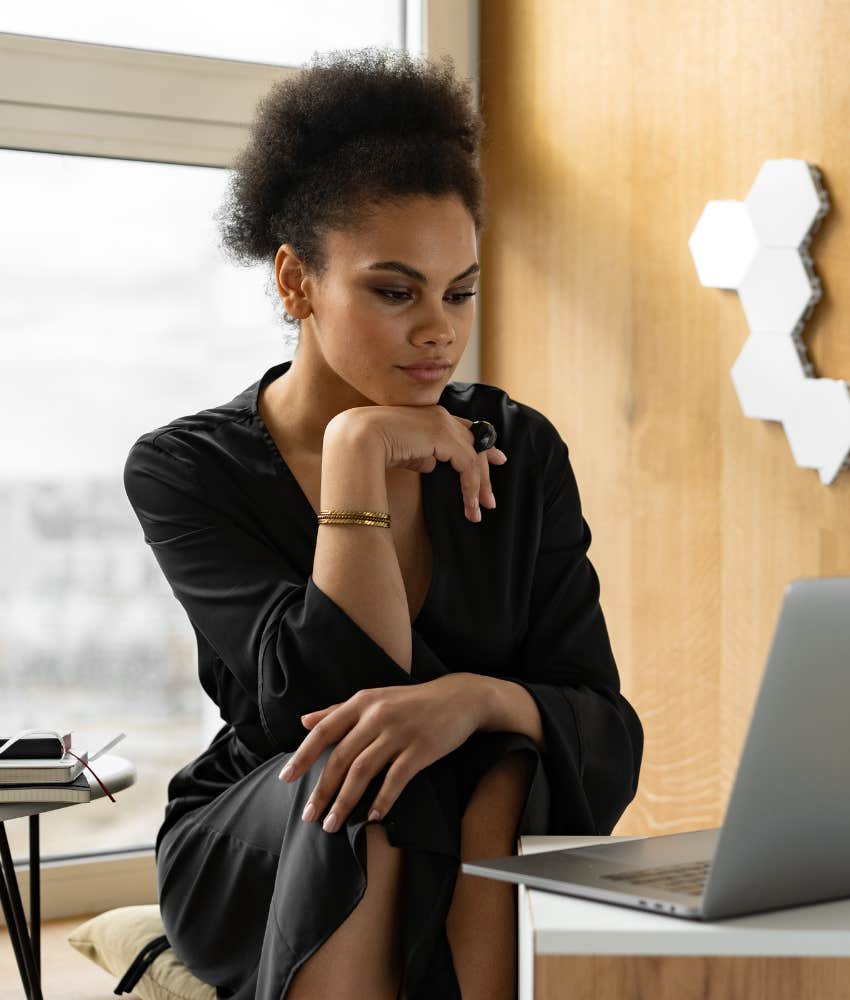 young woman working on laptop in office