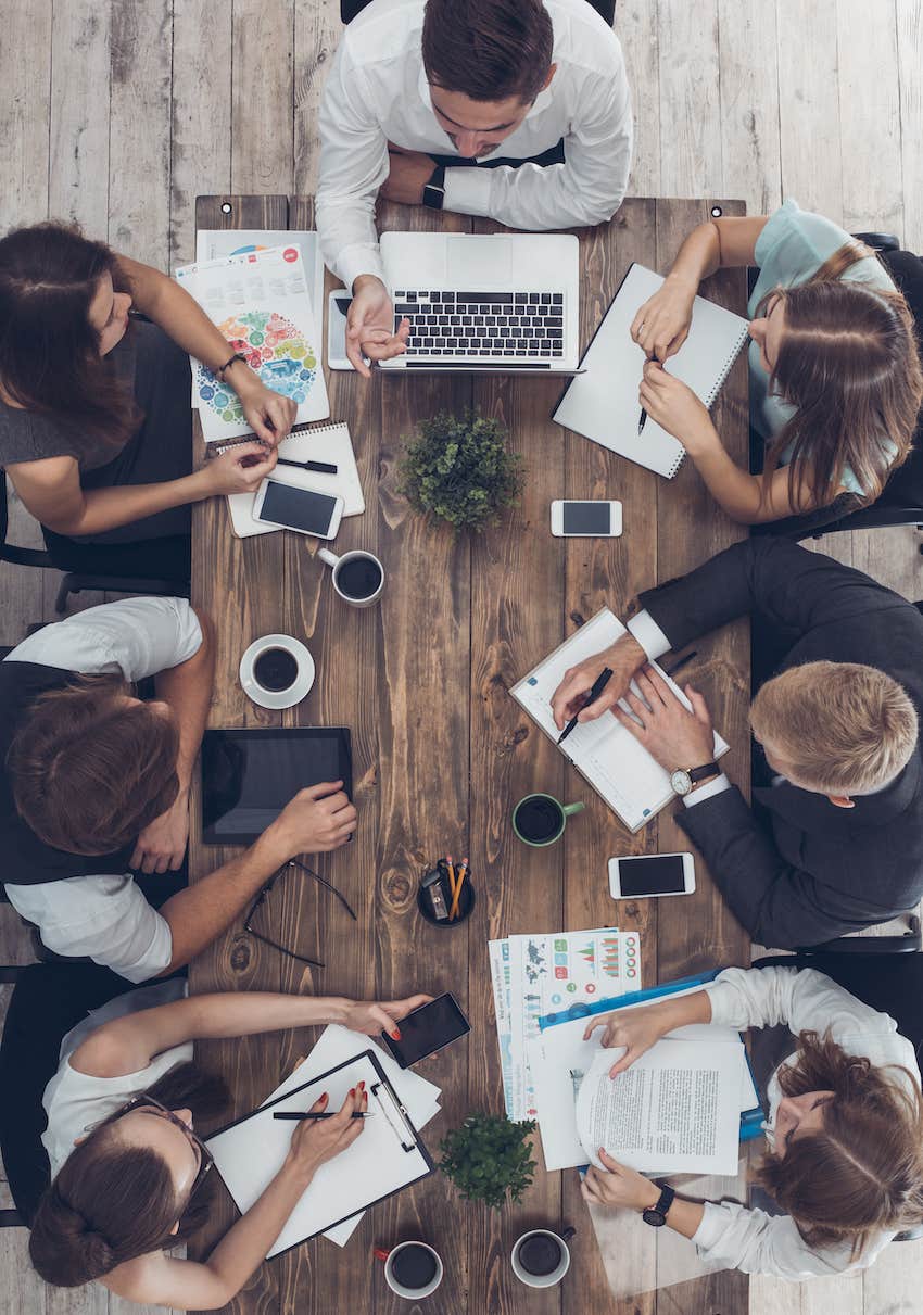 Business meeting overhead view could anyone be dating at work