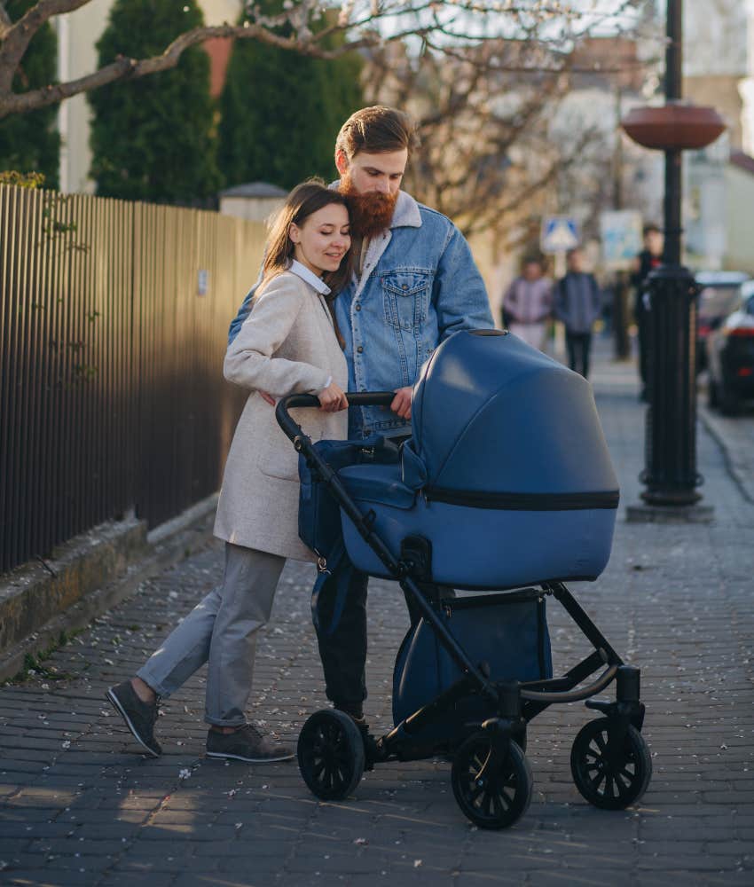 mom and dad with a stroller