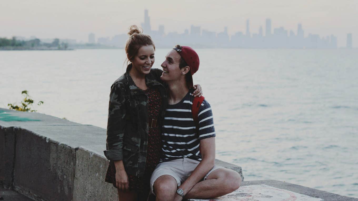 7 Easy-To-Miss Signs Someone's Micro-Flirting With You man and woman hugging