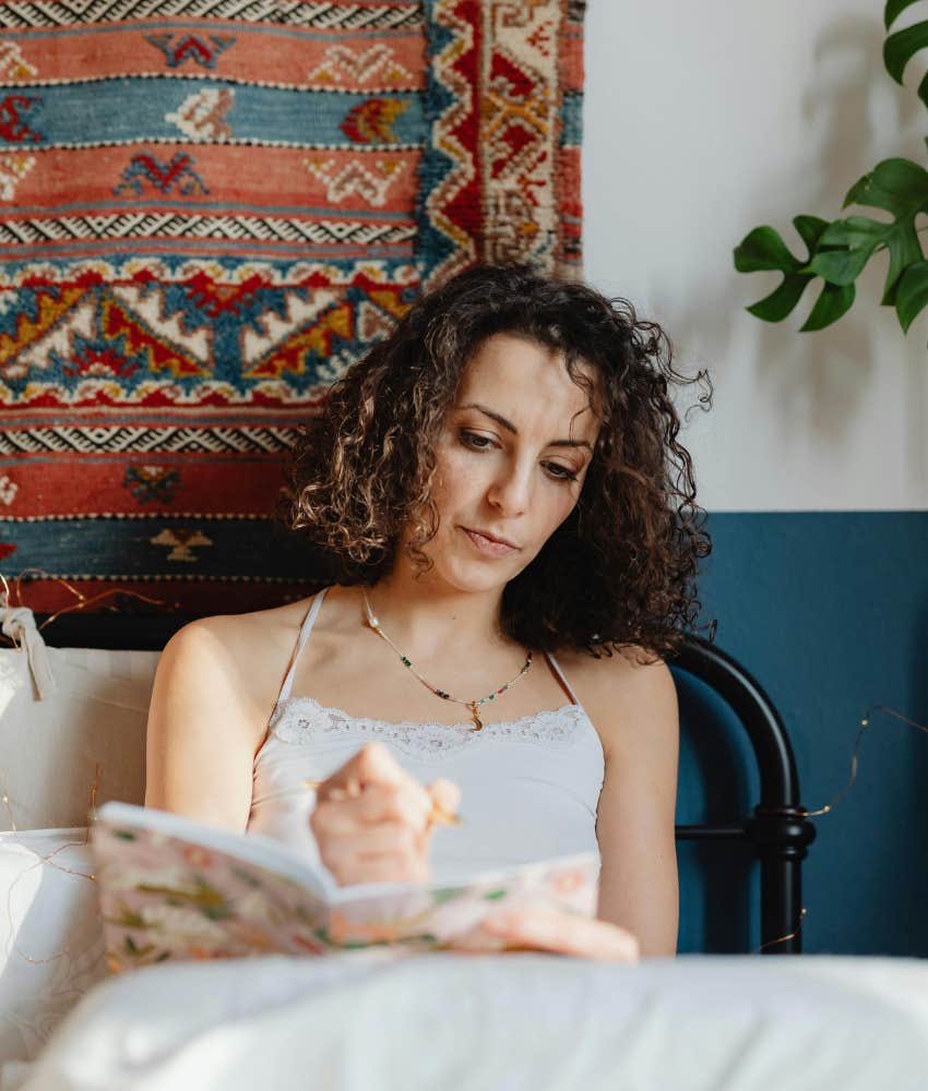 woman writing in journal 