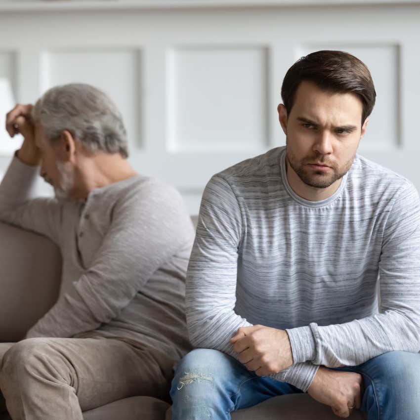 Boomer dad and adult son ignoring each other. 