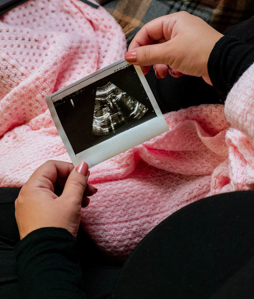 woman holding an ultrasound