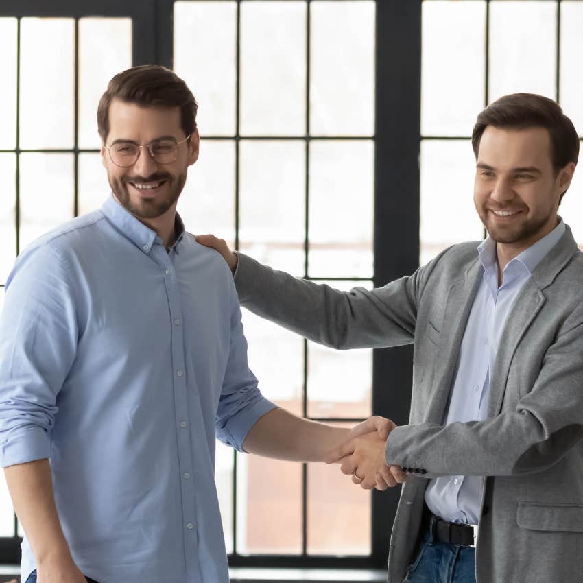 two workers shaking hands