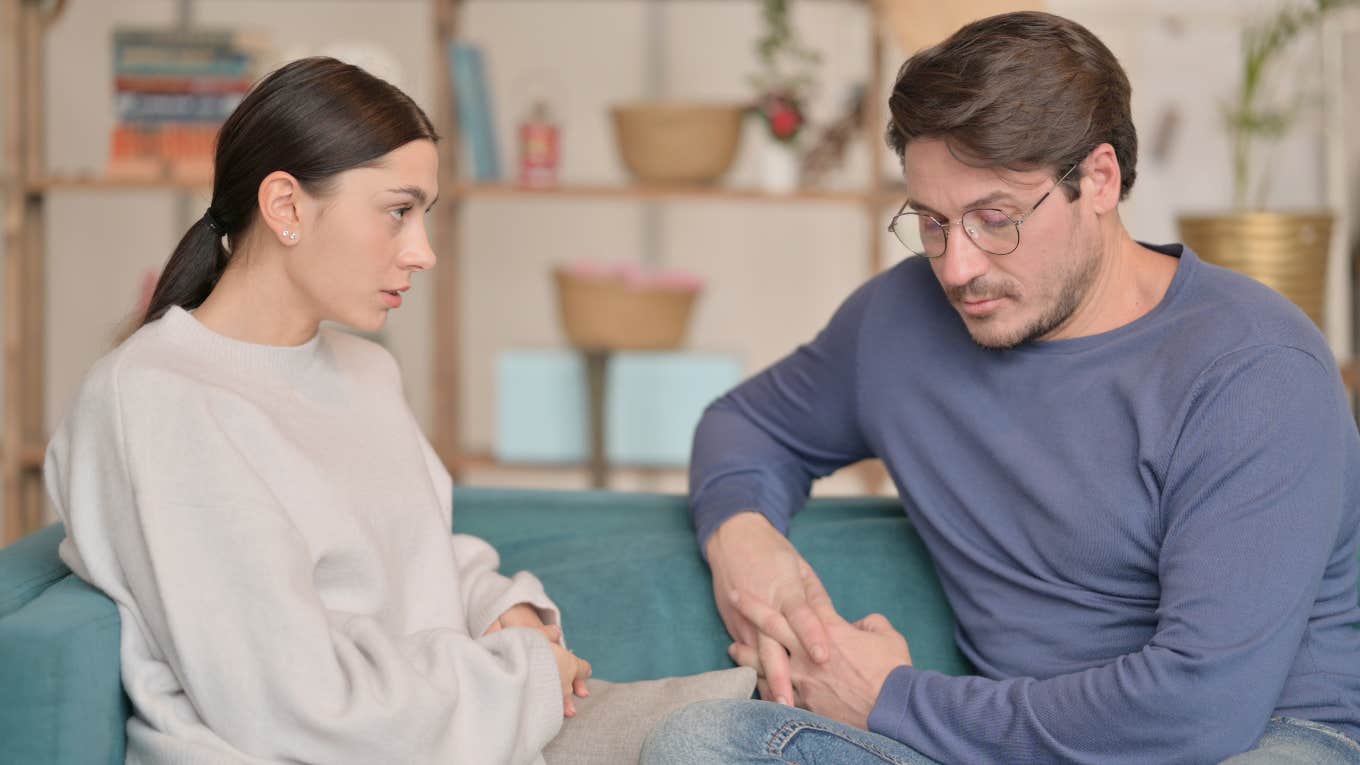 What Avoidant People Need In Relationships couple sitting on couch looking tense