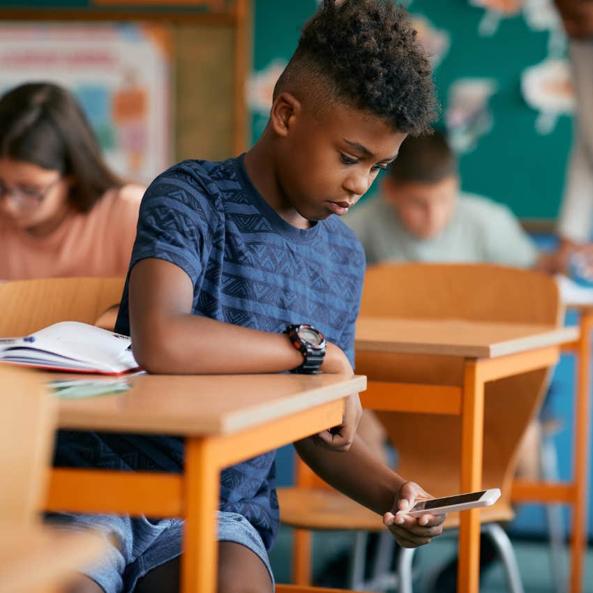 Student secretly on phone during class