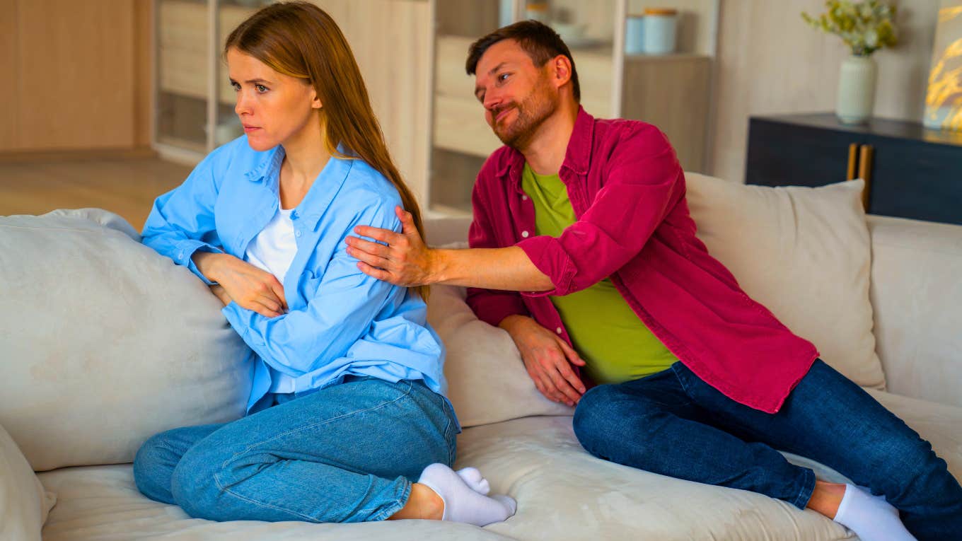 man telling woman to calm down