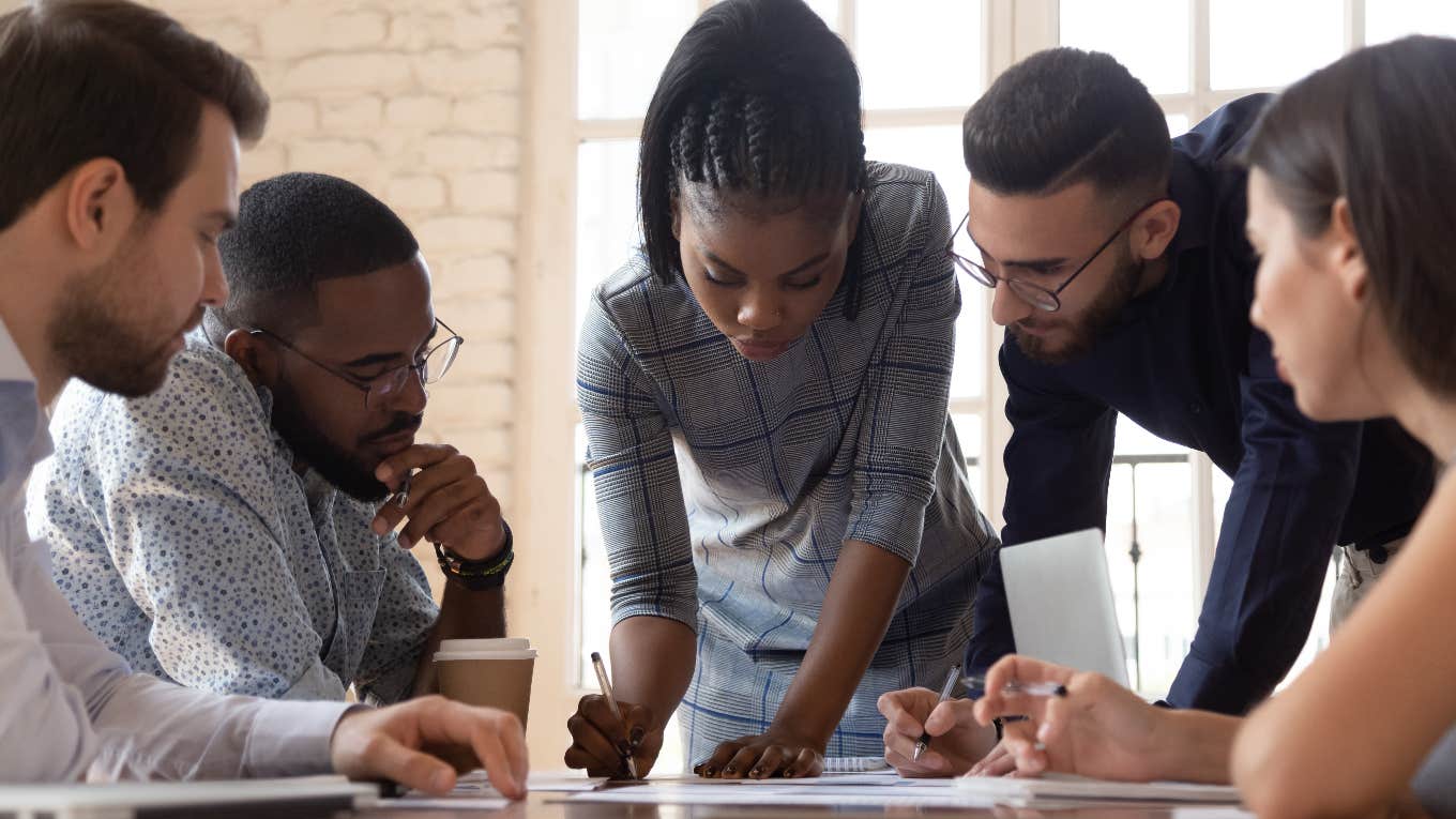 Group of employees looking at paperwork