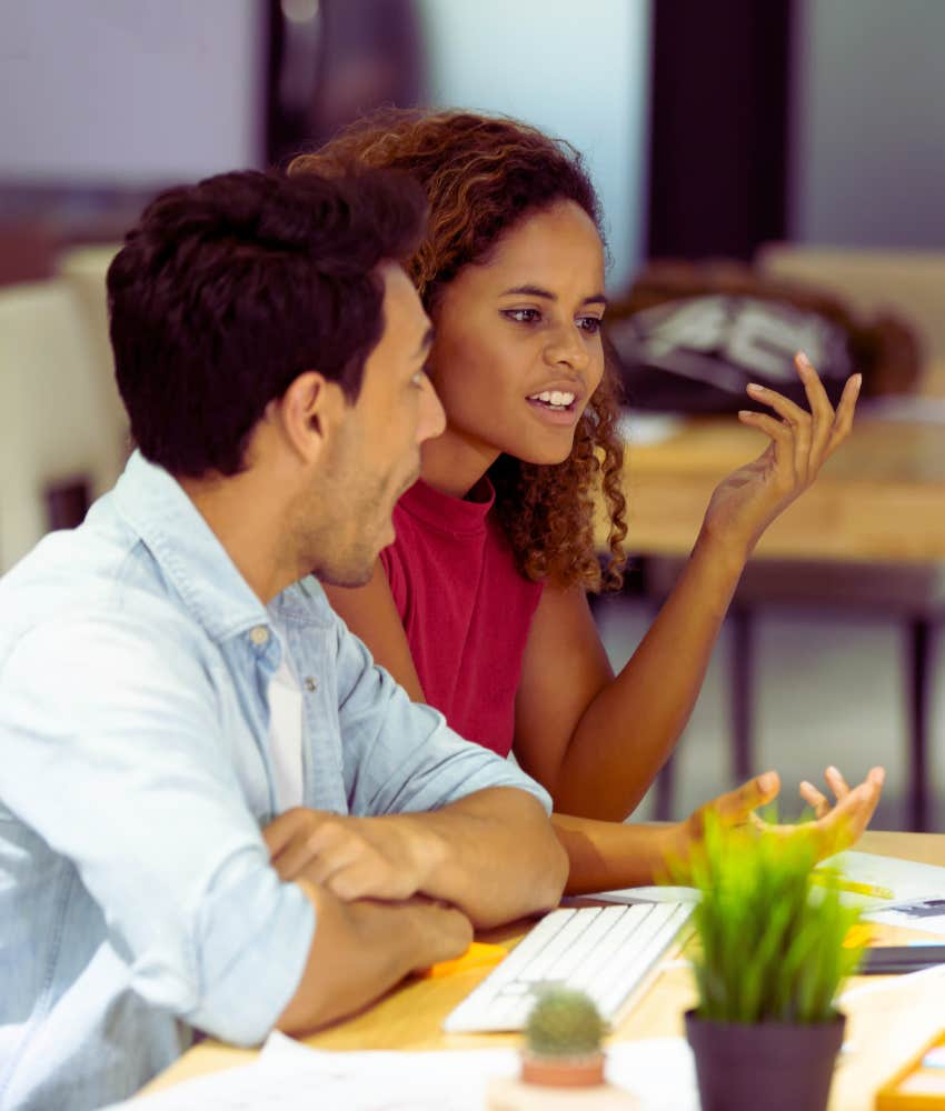 co-workers talking in office