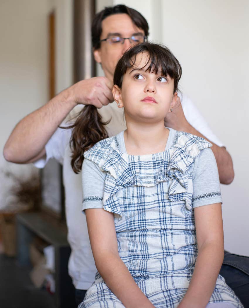 dad doing daughter's hair