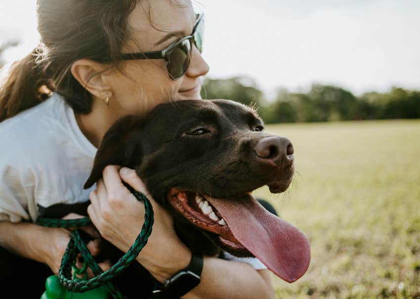 dog with tongue out and person he loves most