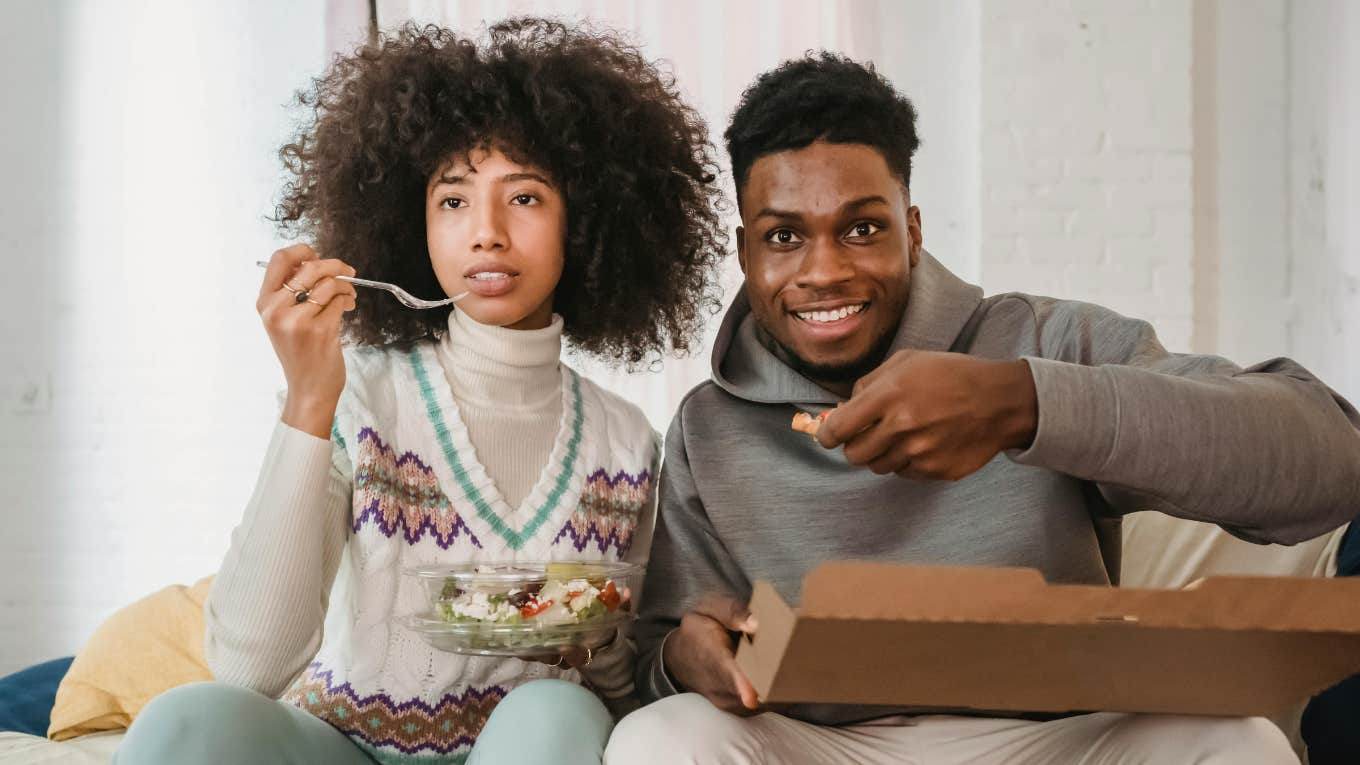 The DoorDash Test That Can Predict If You're With Your Soulmate couple eating takeout together