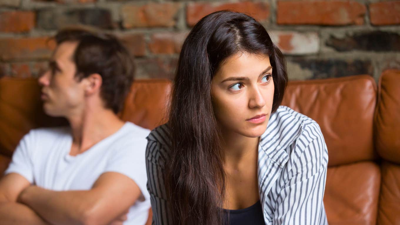 How To Know If You Should Fight For Your Relationship Or Move On couple sitting on couch together